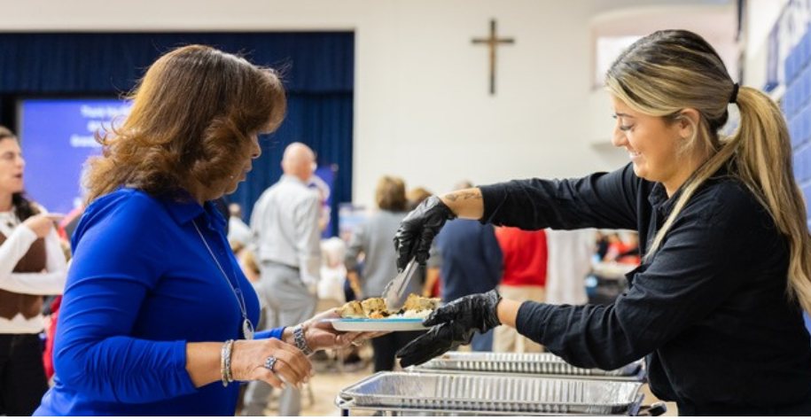 Sevmar staff serving guests at an off-site catered event
